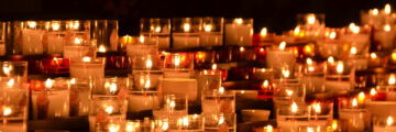 Rows of lit candles