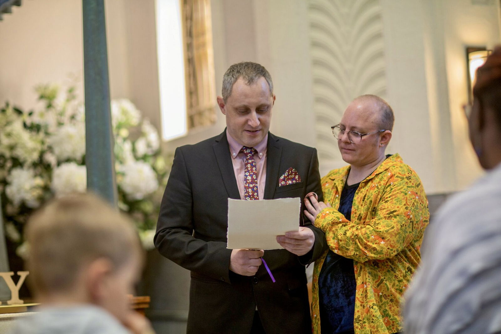 People speaking at funeral
