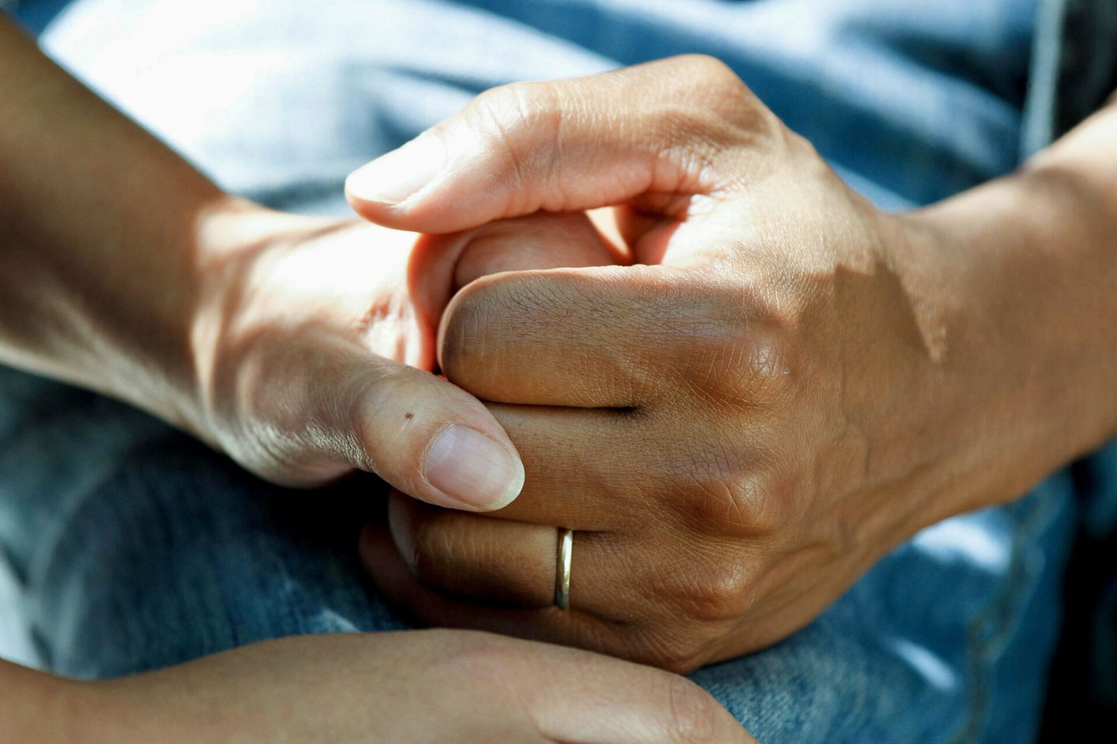 People holding hands in support