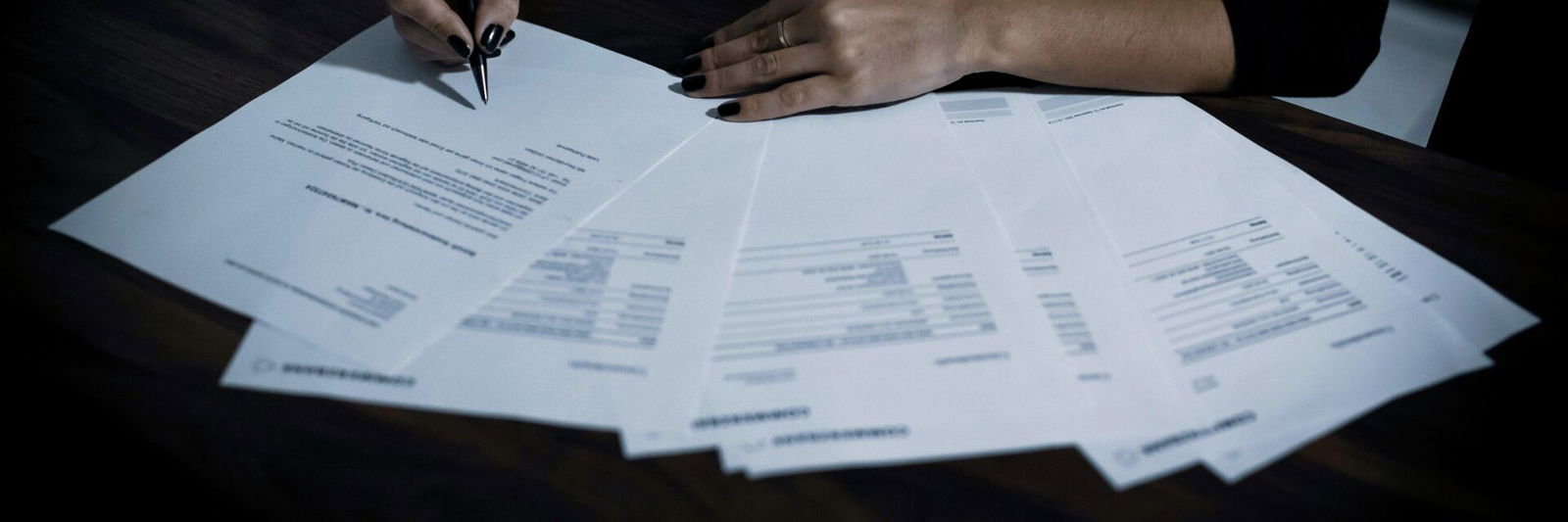 Person doing paperwork on table