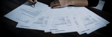 Person doing paperwork on table
