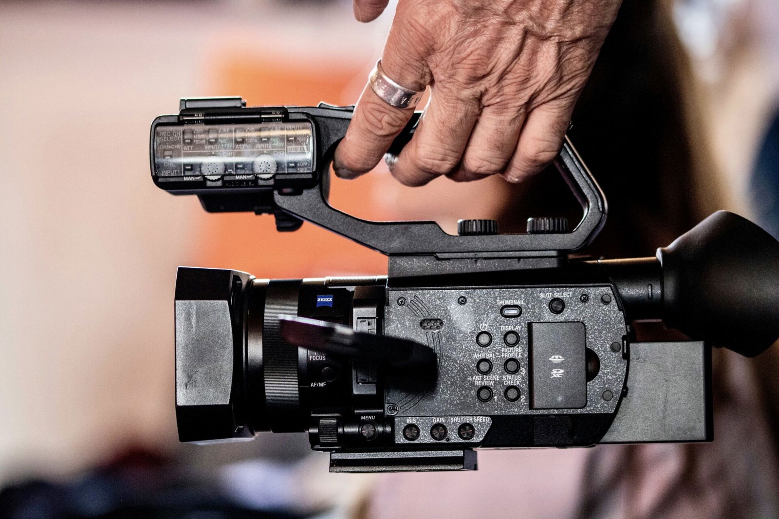 Someone holding digital video camera