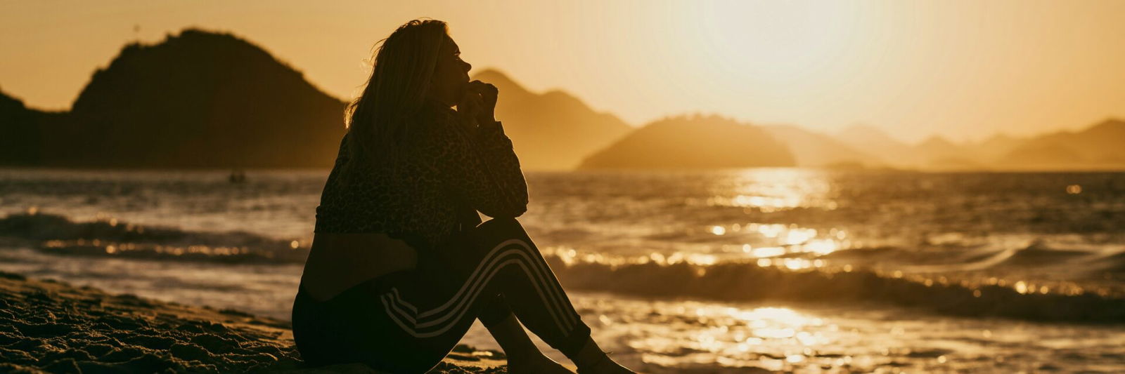 Woman on beach regretting